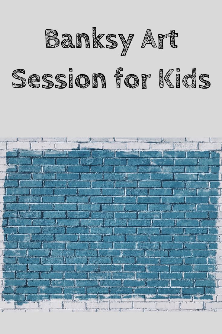 a blue brick wall with the words banksy art session for kids