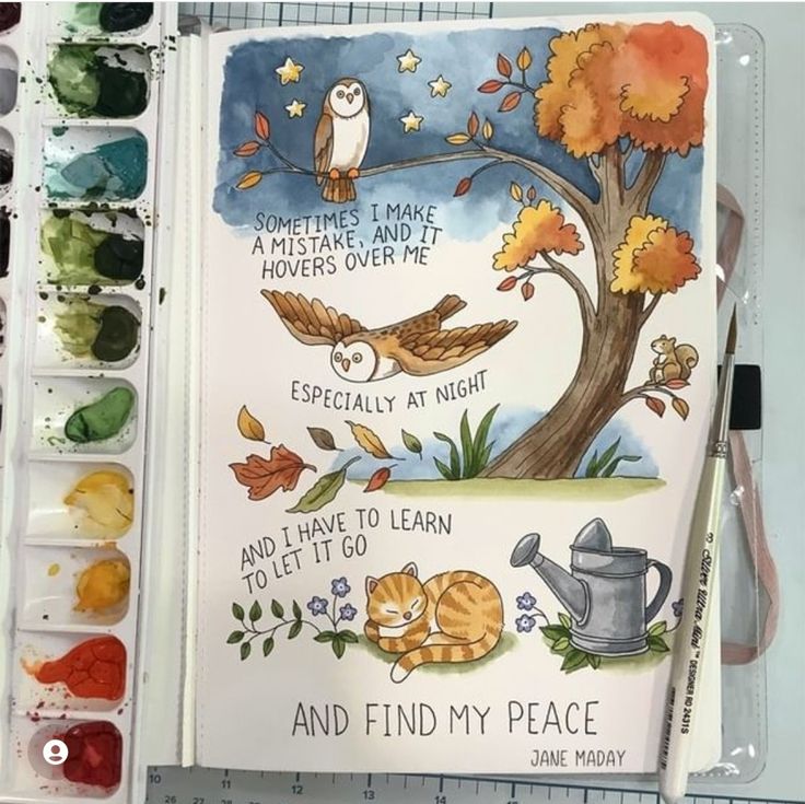 an open book with watercolors and paint on it, featuring owls sitting on a tree