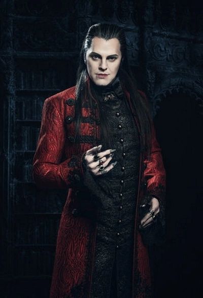 male vampire in red coat and black outfit