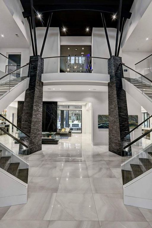 the inside of a modern house with marble floors