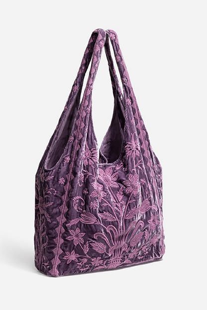 Thoughtfully crafted from a luxurious silk blend, the Talithia Velvet Slouchy Tote is embellished with intricate tone-on-tone floral embroidery in a rich peacock shade for a unique multi-dimensional look. Featuring a wide top opening and an interior slip pocket, this bag is finished with a metal snap closure at the top. Add to your daily look for a hint of drama and eclectic style. Women's Velvet Slouchy Tote Bag by Johnny Was in Dusty Purple, Silk, Floral Johnny Was Bag, Vintage Tote Shoulder Bag, Leather Shoulder Bag For School, Slouchy Leather Bag, Things In Bag, Whimsigoth Bag, Ruffle Tote Bag, Baggy Bag, Christmas Wishlist Ideas