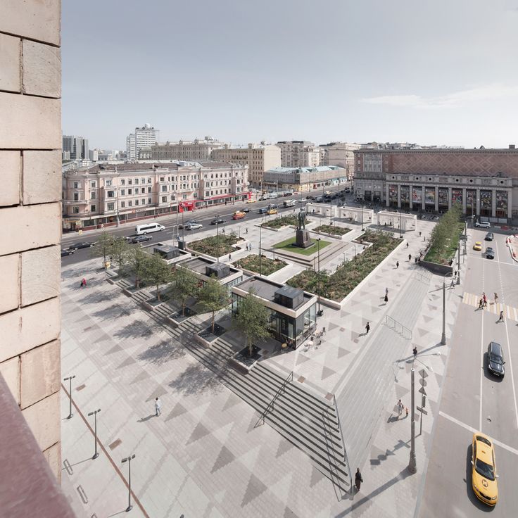 an aerial view of a city square and parking lot