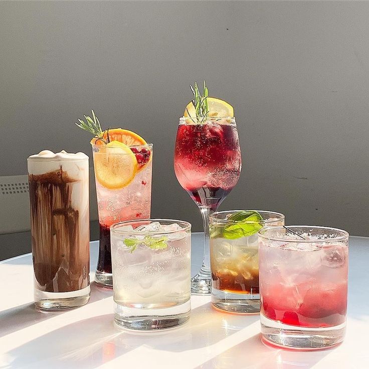 several different types of drinks on a table