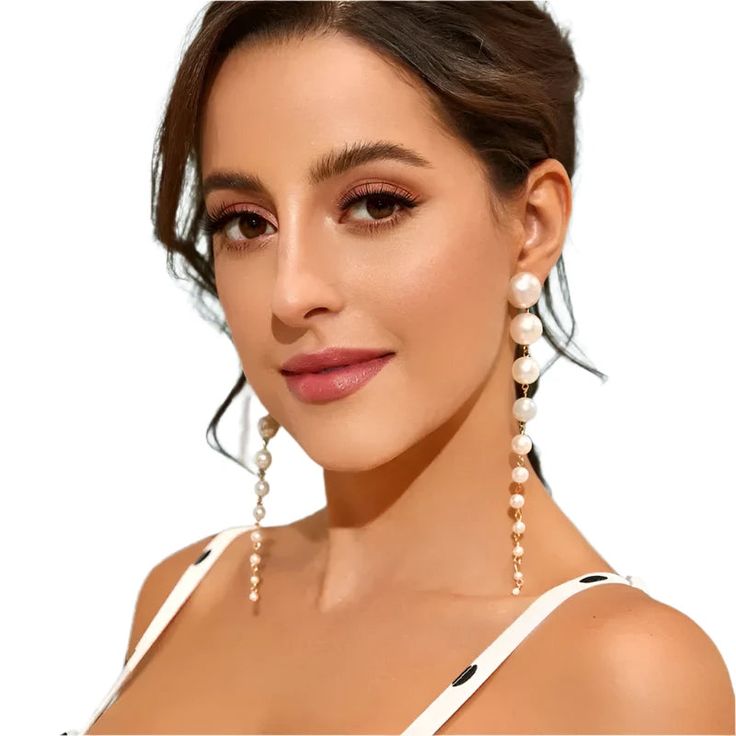 "These elegant GINA Faux Pearl Drop Earrings add a touch of sophistication to any outfit. Made with precision craftsmanship, the faux pearls have a lustrous finish that mimics the beauty of natural pearls. The versatile design makes these earrings perfect for both formal and everyday wear." Approximately 5.5 inches in length. Nickel and lead compliant. Long Pearl Earrings, Long Drop Earrings, Long Dangle Earrings, Pearl Earrings Dangle, Stunning Earrings, Accessories Jewelry Earrings, Pearl Drop Earrings, Tassel Earrings, Jewelry Party