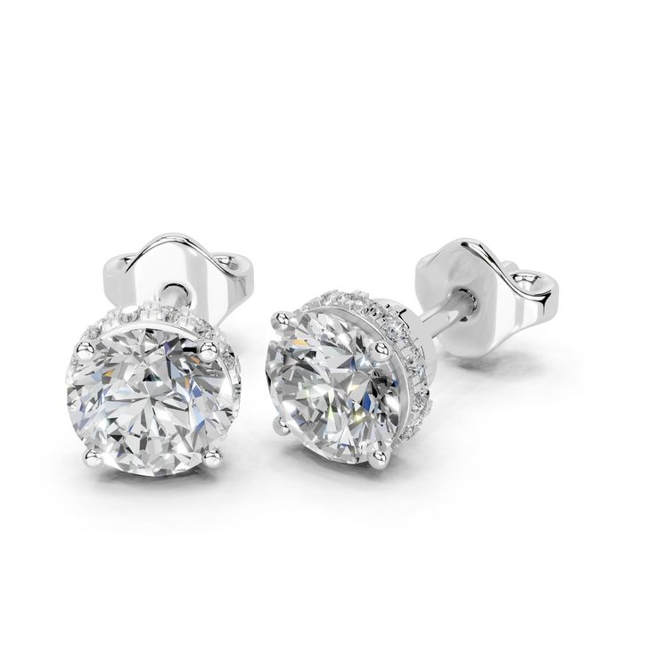 ABOUT SETTING: Round Brilliant Cut Lab Grown Diamond Halo Stud Earrings for women Setting, Featuring a timeless design that securely holds and showcases the brilliance of the solitaire diamond. ABOUT DIAMOND: These earrings feature lab-grown diamonds, guaranteeing they are sourced ethically. The size indicates the total diamond weight of the earring pair or the total weight of both diamonds. REFUND & RETURNS: Enjoy the comfort of a 30-day return policy. If you're not completely satisfied with your earrings, you can return them within 30 days for a full refund. CERTIFICATION: Each of our diamonds over 1 carat comes with an IGI certification, ensuring their quality and authenticity. Additionally, our jewelry pieces are also certified by IGI. This guarantees that you receive not only beautifu Formal Bridal Earrings With Vvs Clarity, Round Shape, Formal Round Bridal Earrings With Vvs Clarity, Diamond Cut Bridal Earrings For Anniversary, White Bridal Earrings With Vvs Clarity, Formal Bridal Earrings With Vvs Clarity, Formal Bridal Earrings With Brilliant Cut, Dazzling Bridal Earrings With Vvs Clarity, Diamond Cut Bridal Earrings In Fine Jewelry Style, Dazzling Vvs Clarity Bridal Earrings