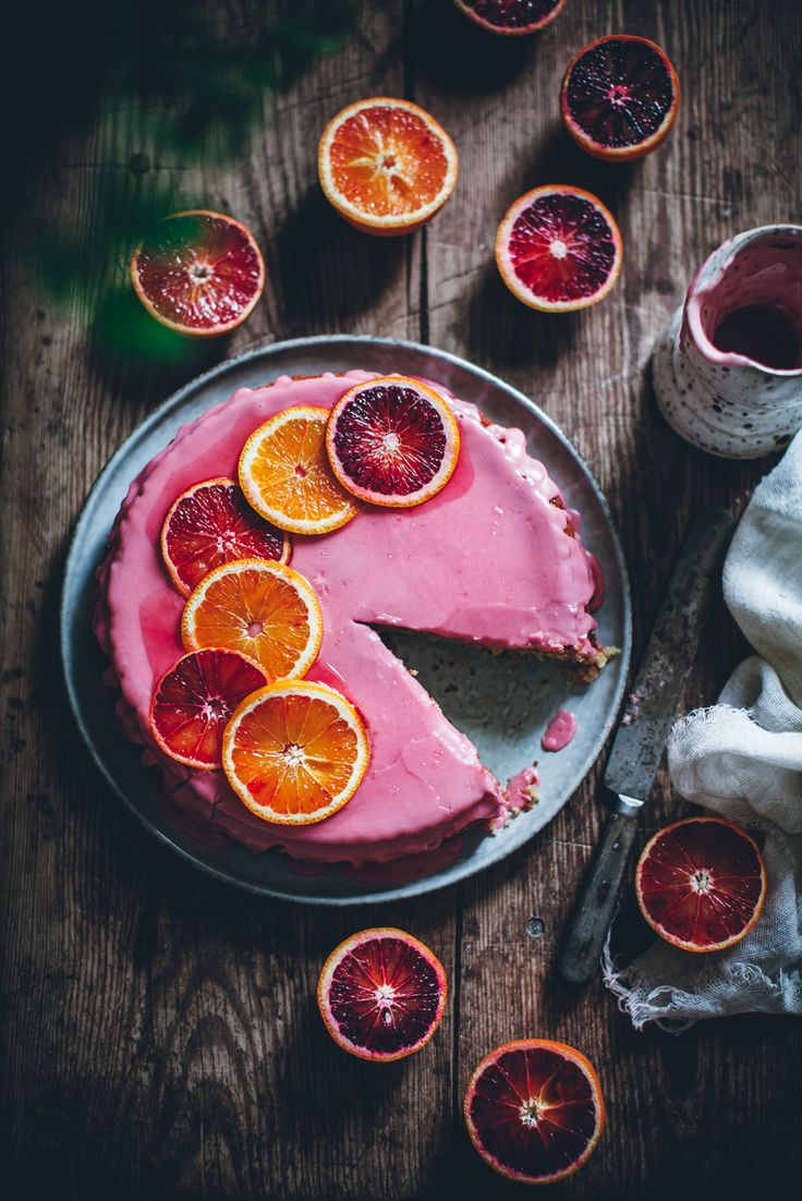 a cake with blood orange slices on it