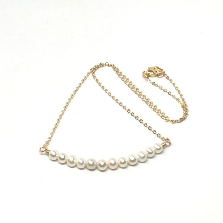 This pretty and dainty pearl necklace is made with twelve small 3mm pearls and 14k gold filled chain with a 14k gold filled lobster clasp. This simple but elegant necklace is so versatile that it can be worn with the most casual to most formal of outfits. The necklace is available in four necklace lengths. Please choose the length you need from the drop-down menu. The necklace will arrive in an attractive gift box. Everyday 14k Gold-filled Pearl Necklace With Delicate Chain, Dainty Single Strand Pearl Necklace In 14k Gold, Dainty 14k Gold-filled Single Strand Pearl Necklace, Simple Gold Pearl Chain Necklace, Gold Pearl Necklace With Simple Chain, Simple Gold Pearl Necklace With Delicate Chain, Gold Pearl Necklace With Delicate Chain, Pearl Gold Chain, Small Pearl Necklace