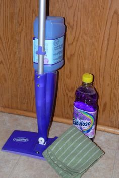 a purple umbrella and cleaning supplies on the floor