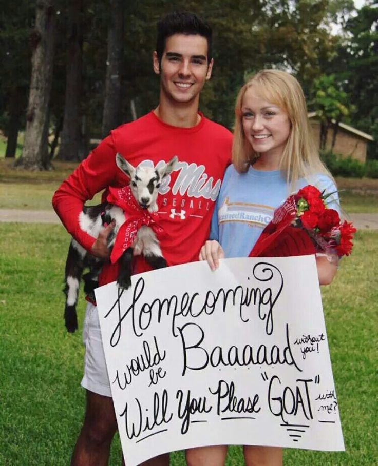 a man and woman standing in the grass holding a sign that says, homegrowing works are baaaad will you please got?