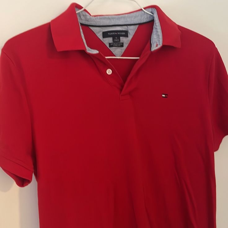 Size : M In Perfect Condition No Rips Stain Or Any Damage Red Polo With Logo On The Chest Area Pit To Pit 18" Red Fitted Polo Collar T-shirt, Tommy Hilfiger Red Cotton Shirt, Red Tommy Hilfiger Cotton Shirt, Casual Red Top With Collar, Classic Fitted Red T-shirt, Tommy Hilfiger Red Short Sleeve Top, Fitted Tommy Hilfiger Polo Collar Top, Red Polo, Tommy Hilfiger Polo