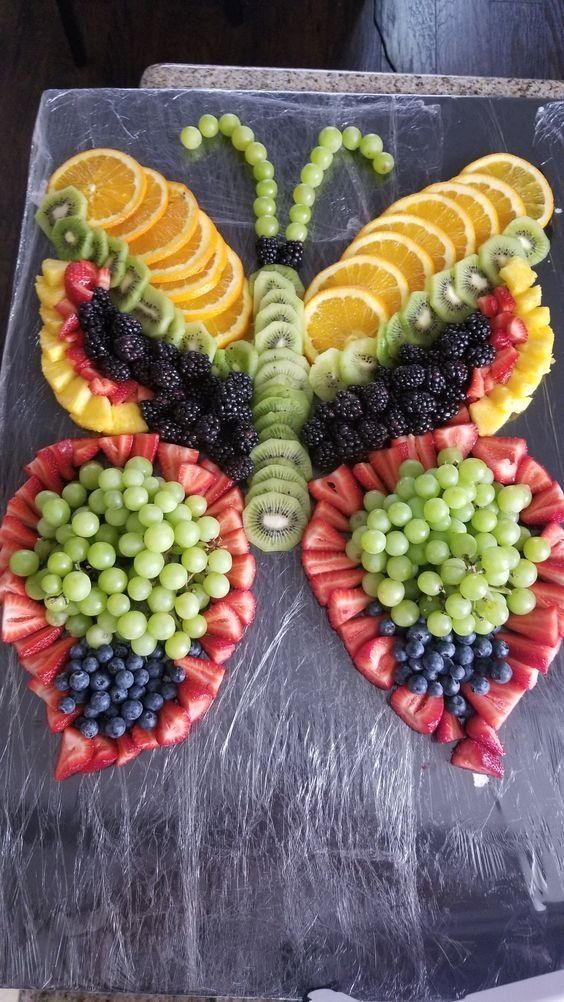 a butterfly made out of fruits and vegetables