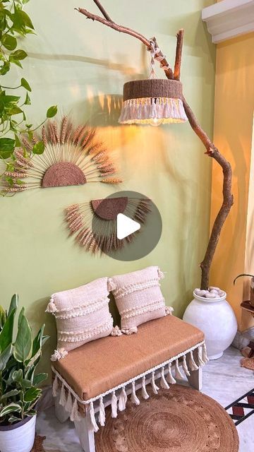 a living room filled with lots of furniture and plants on the wall next to a window