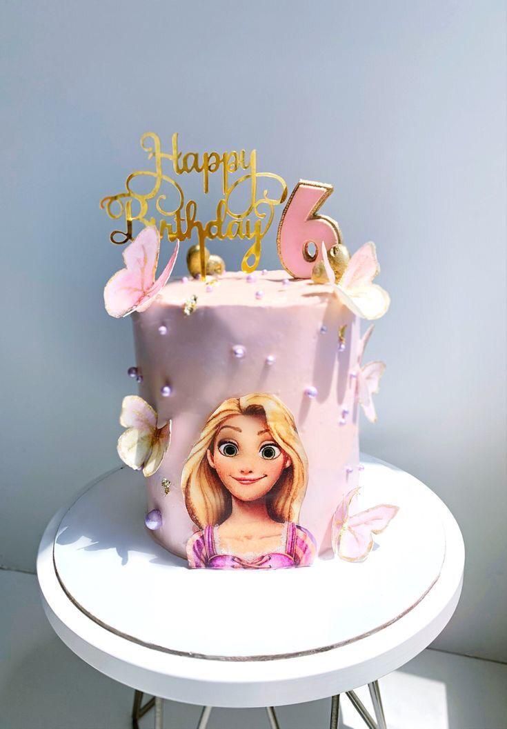 a birthday cake with a barbie doll on it