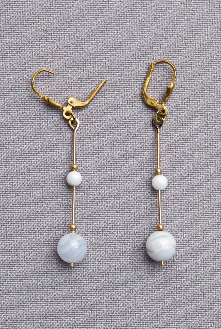 Lightweight chalcedony earrings made of a larger and a tiny bead of chalcedony fixed on a sturdy gold wire, decorated with tiny gold beads. Including the safe and beautifully shaped lever-back (see photos 1 + 2) everything is handcrafted and crafted in goldfilled metal (see FAQ). Each earring is - without lever-back - approx. 42 mm long and 8 mm wide. >Delivery times from payment: >Germany  and EU:  3-8 days,  >USA and Canada: 10-20 days, >Norway, Switzerland, UK: 5-10 days, >Australia and other Elegant Brass Beaded Earrings With Round Beads, Elegant Jade Beaded Earrings With Round Beads, Elegant Brass Beaded Earrings, Elegant Beaded Jade Earrings, Elegant Beaded Chalcedony Jewelry, Elegant Wire Wrapped Chalcedony Jewelry, Elegant Jade Beaded Round Earrings, Gold Agate Earrings For Jewelry Making, Elegant Beaded Agate Earrings