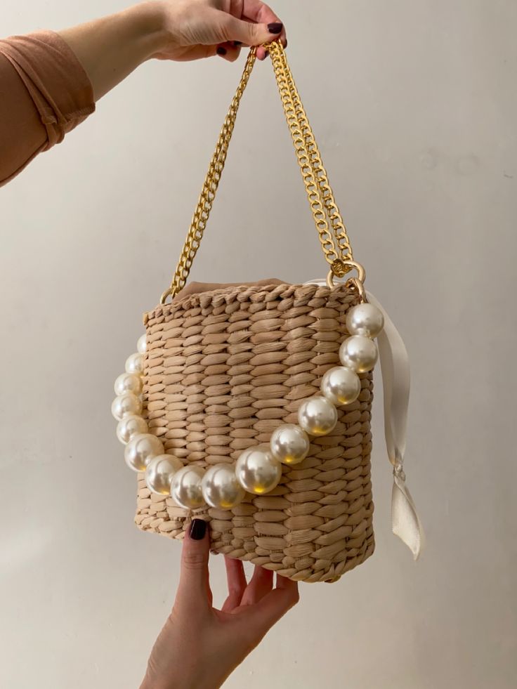 Elegant Summer Clutch Bag, Elegant Natural Color Shoulder Bag, Beige Rectangular Bucket Bag For Party, Elegant Rectangular Straw Bag With Chain Strap, Summer Evening Bag Made Of Pearl, Summer Evening Pearl Bag, Everyday Bucket Shoulder Bag With Pearl Handle, Summer Beige Shoulder Bag With Pearl Handle, Cream Crossbody Shoulder Bag With Pearl Handle