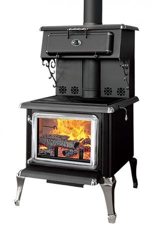 a black stove top oven sitting on top of a white floor next to a wall