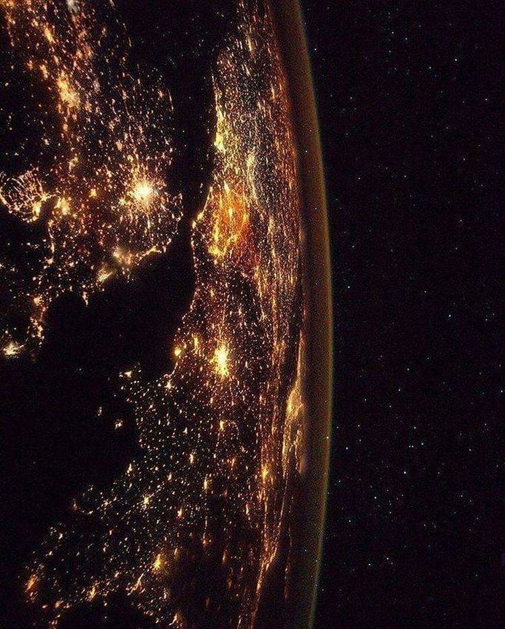 the earth is lit up at night from space