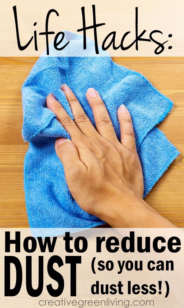 someone wiping up their hands on a blue towel with the words life hacks how to reduce dust so you can dust less