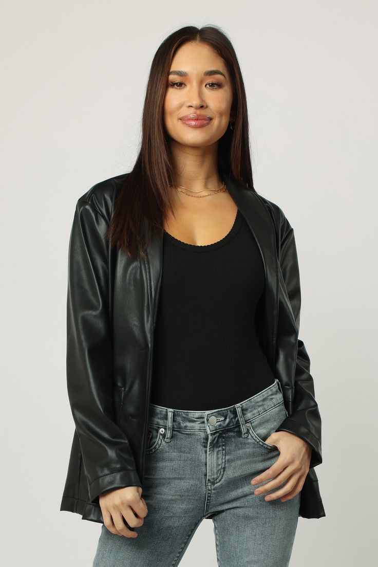 Blazer jacket long sleeve with button closures, patch pockets in vegan leather body. Ever versatile, perfect blend of chic or formal! Solid color vegan leather on standard fit.Body length from HPS: 28", Sleeve length: 22 1/2", Bust: 40" (Size Small) 100% PU (VEGAN LEATHER) Dry clean only Imported Trendy Leather Jacket For Business Casual, Sleek Leather Jacket For Business Casual In Fall, Black Outerwear With Faux Front Pockets For Night Out, Sleek Long Sleeve Leather Jacket, Faux Leather Outerwear With Pockets For Night Out, Trendy Leather Outerwear For Business Casual, Sleek Fall Blazer For Night Out, Sleek Notch Lapel Outerwear For Night Out, Sleek Single-breasted Leather Jacket With Long Sleeves