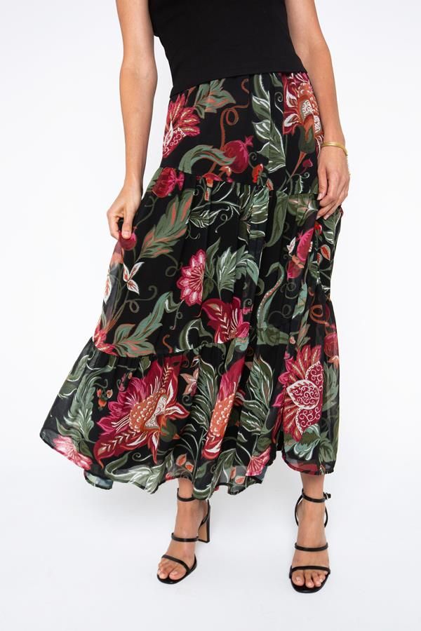 The defining feature of this skirt is its tiered constructionMaterial allow the skirt to drape and move beautifully, providing comfort and a graceful silhouette. Tiered Ruffled Maxi Skirt, Flowy Lined Tiered Dress, Tiered Dress With Lined Skirt, Flowy Tiered Dress With Lined Skirt, Chic Tiered Maxi Skirt With Layered Hem, Flowy Long Skirt With Layered Hem, Spring Tiered Layered Maxi Skirt, Tiered Ruffle Maxi Skirt For Vacation, Ruffled Tiered Maxi Skirt For Vacation