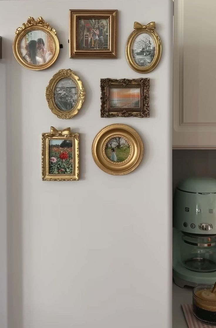 there are many framed pictures on the wall in this kitchen, and it is easy to put together