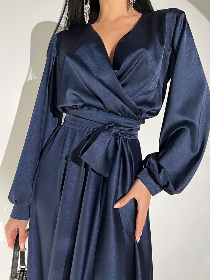 Fabric: Satin 60% polyester, 38% viscose, 2% elastane Longsleeve Maxi length V-neckline Wrap dress Belt included Dress length: 144 cm Sleeve length: 61 cm Color: white, black, beige, navy blue, emerald Size: S, M, L, XL Elegant V-neck Dress With Surplice Neckline For Fall, Elegant Solid Color V-neck Party Dress, Elegant V-neck Wrap Dress For Spring, Elegant Formal V-neck Dress In Solid Color, Elegant Long Sleeve V-neck Dress For Night Out, Chic Long Sleeve V-neck Evening Dress, Fitted V-neck Long Sleeve Evening Dress, Fitted V-neck Long Sleeve Dress For Evening, Fitted Long Sleeve V-neck Dress For Evening