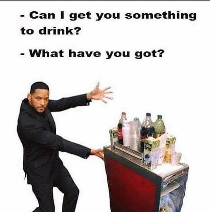 a man pushing a cart with drinks on it that says can i get you something to drink? what have you got?