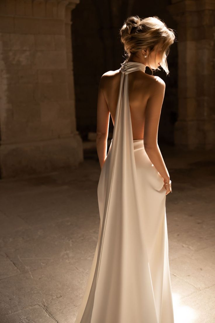 the back of a woman in a white dress