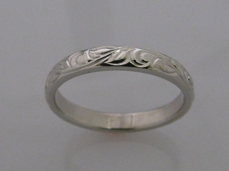 This is my Vine and Leaf Hand Engraved Wedding Band in Palladium white gold, it is a wonderful alternative to the standard 14k white gold which has nickel in it and causes an adverse reaction for some people and is referred to as nickel itch. Band shown in a size 7. Add $50 per size over a size 7. Vine Leaf copyright 2009 Luxury Silver Engraved Bands, Luxury Engraved Silver Bands, Elegant Etched Wedding Bands For Formal Occasions, Round Engraved Bands For Marriage, Classic Silver Engraved Ring In 14k White Gold, Elegant Engraved Ring With Round Band, Elegant Engraved Round Band Ring, Platinum Engraved Ring For Formal Occasions, Elegant Etched Engraved Ring For Promise