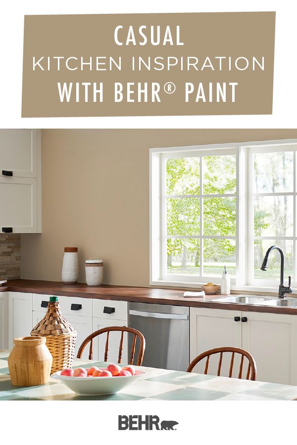 a kitchen with white cabinets and brown counter tops is featured in the behr paint catalog