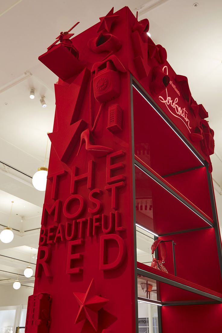 a red display case in the middle of a room