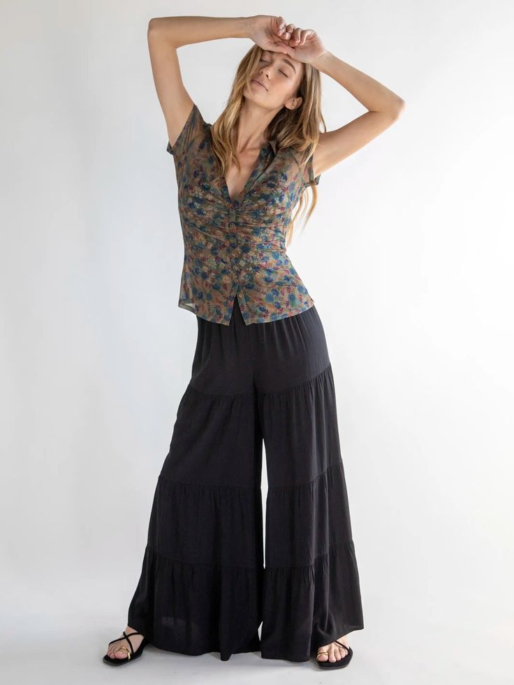 Jazz up your style with the Patti Palazzo Pant! Embrace the ease and breeziness of the super expandable elastic waistband that ensures a snug fit, paired with the comfort of the roomy, tiered wide legs. These black pants offer the best of both worlds - the flowy charm of a maxi skirt with the practicality of pants! Dress them up for work or dinner dates, or keep it casual...no matter the occasion, you'll feel incredibly cute and comfy in these super stylish palazzo pants! Black Palazzo Pants, Dinner Dates, Dressy Shirts, Palazzo Pant, Fun Pants, Pants Dress, Cute Clothes, Peasant Blouse, Wide Legs