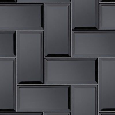 a wall made up of square and rectangles in dark grey color with black background