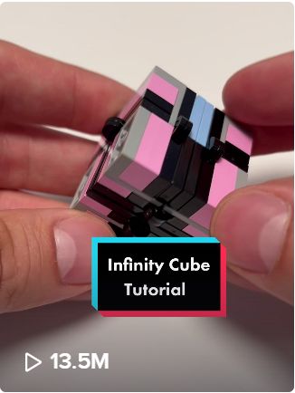 someone is holding a small cube in their hand with the text, infinite cubes