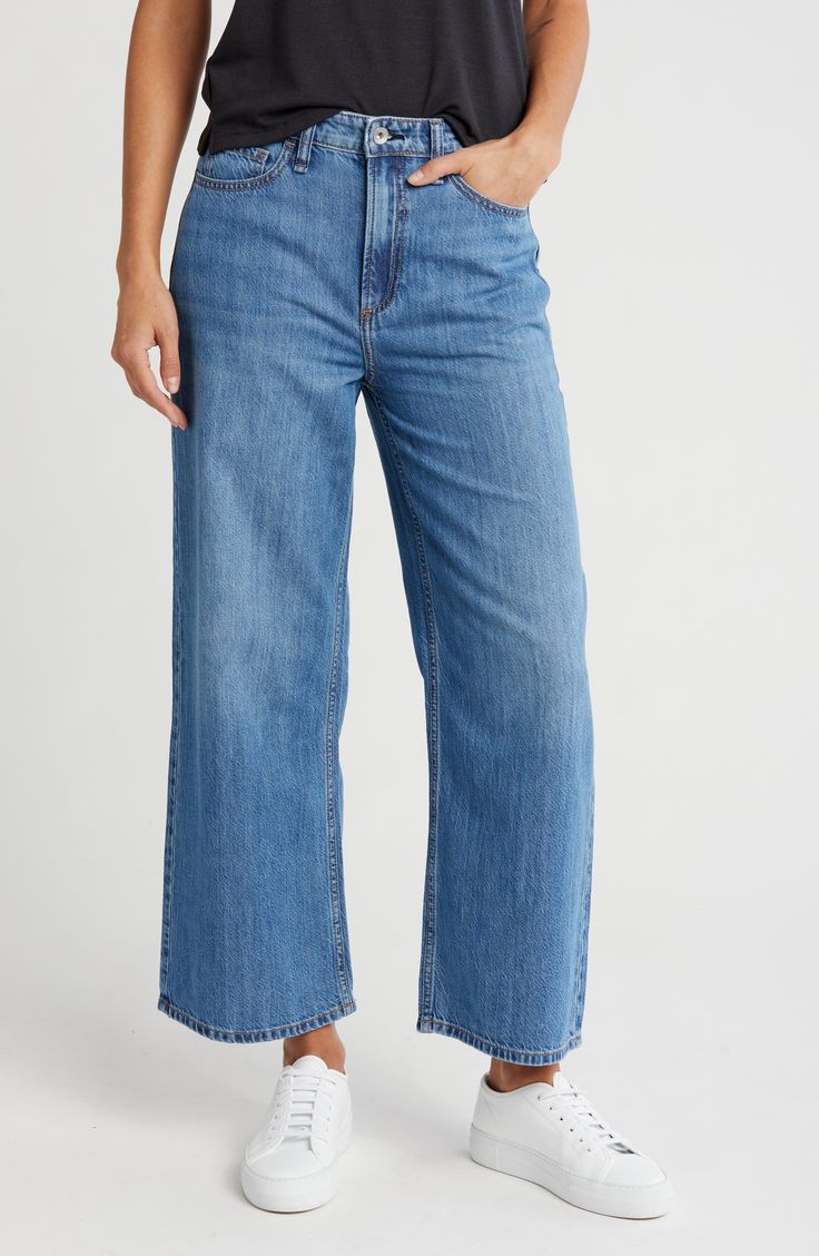 Enjoy the comfort of mid-rise wide-leg jeans constructed from soft denim in a cropped silhouette. 26 1/2" inseam; 12" front rise (size 26) Zip fly with button closure Five-pocket style 63% cotton, 37% lyocell Machine wash, line dry Imported Distressed Dark Wash Wide Leg Cropped Jeans, Everyday Mid-rise Denim Wide Leg Pants, Medium Wash Cotton Wide-leg Jeans, Dark Wash Wide-leg Cropped Jeans With Pockets, Dark Wash Wide-leg Cropped Cotton Jeans, Cropped Wide Leg Jeans, Man Up, Rag And Bone, Short Rompers