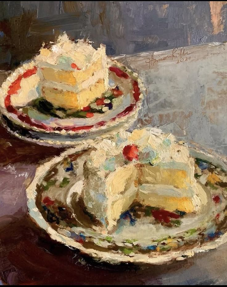 two plates with cake on them sitting on top of a table next to each other