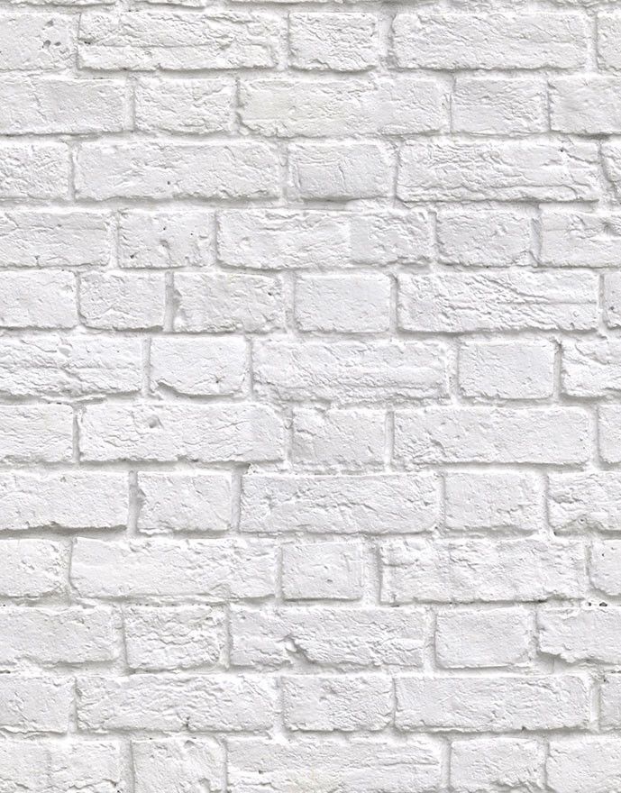 a white brick wall textured with cement