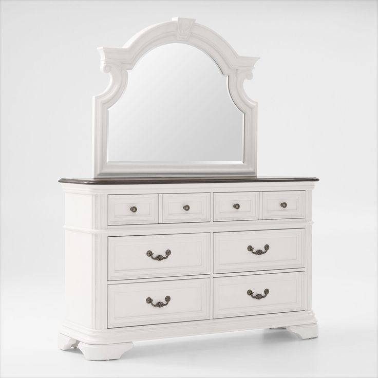 a white dresser with a mirror on top of it and drawers in front of it