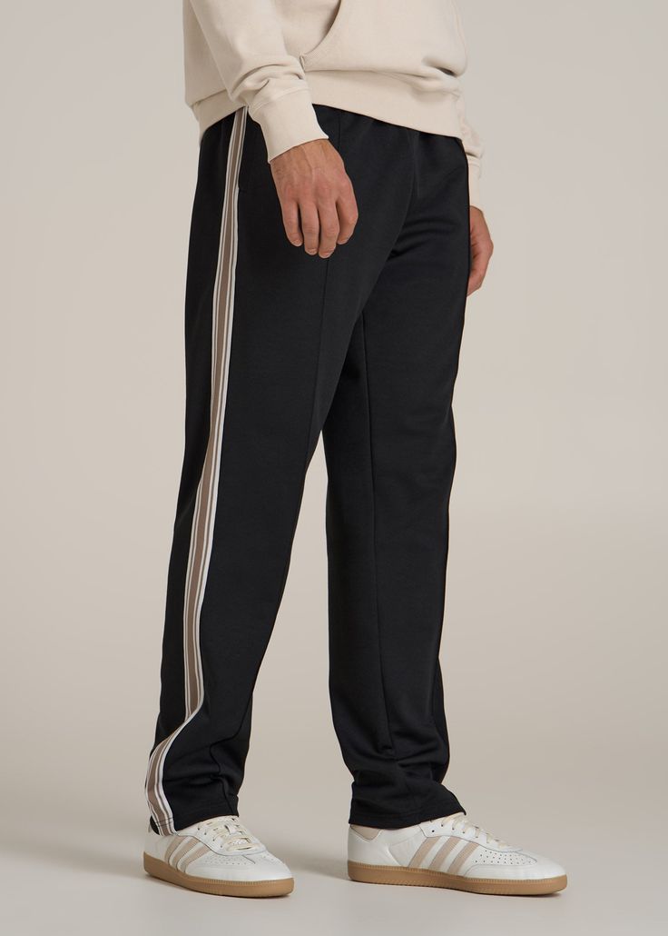 Track Pants Made for the Long-Legged Runner Hit Your Stride For the tall man who never slows down, our Tricot Extra-Long Track Pants are here to keep up. Whether you're sprinting on the track or sprinting through errands, these men's tall active pants offer the stretch and comfort you need to move freely. The mid-rise fit ensures they sit comfortably, while the internal drawstring keeps them secure. Pre-washed to maintain size and quality, these are the athletic pants for tall men you'll reach f Black Straight Leg Bottoms With Side Stripes, Black Tapered Leg Sweatpants For Gym, Black Full-length Bottoms With Side Stripes, Black Full Length Bottoms With Side Stripes, Black Gym Pants With Comfort Waistband, Black Straight Leg Sweatpants For Jogging, Black Straight Leg Jogging Bottoms, Black Straight Leg Bottoms For Jogging, Black Joggers With Tapered Leg And Elastic Side Panels