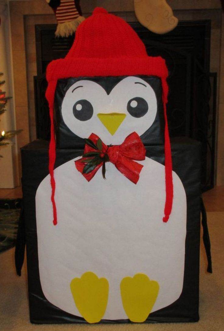 a penguin with a red hat and bow tie