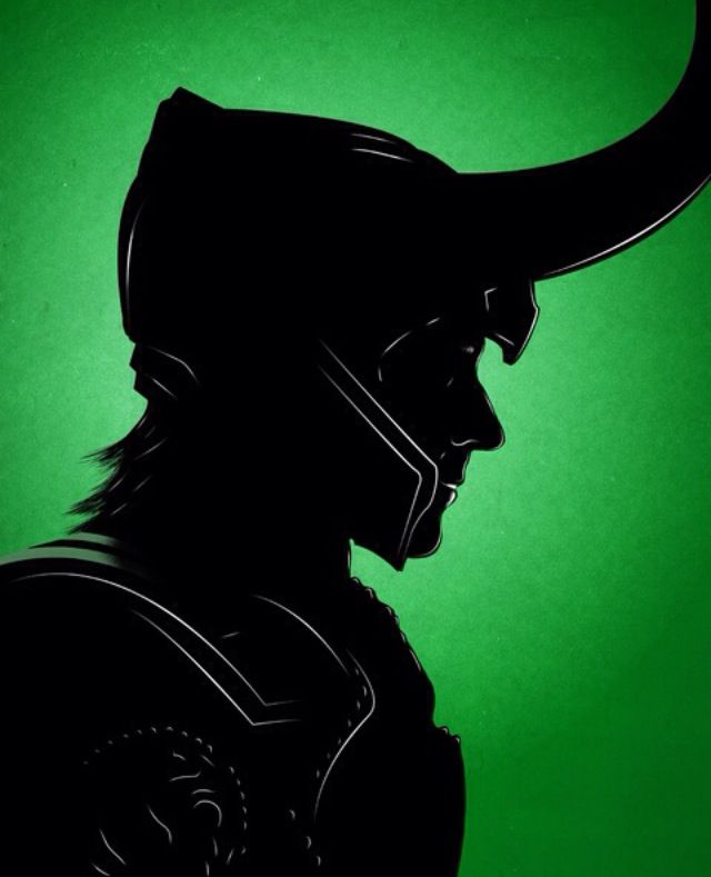 the silhouette of a man wearing a helmet with horns on his head, against a green background