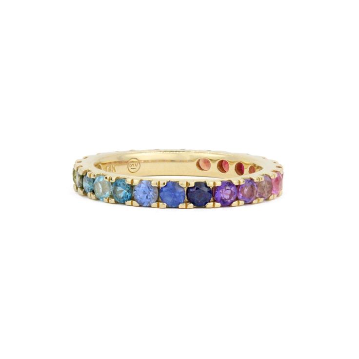 The Stevie Wren Jumbo 14k Gemstone Eternity Band is a stunning piece of jewelry that exudes elegance and charm. This exquisite ring features a dazzling rainbow ombre of paved gemstones, totaling 1.89 carats, creating a vibrant and eye-catching display. The full round cut gemstones are meticulously micro pave set, showcasing precision and attention to detail.Designed with versatility in mind, this band can effortlessly stack together with your favorite ring or make a bold statement on its own. Th Cheap Multicolor Band Jewelry, Rainbow Multi-stone Diamond Jewelry, Rainbow 14k Gold Stackable Jewelry, Rainbow Diamond Jewelry With Multi-stone, Fine Multicolor Halo Jewelry, Fine Jewelry With Multicolor Halo, Rainbow Multi-stone 14k Gold Jewelry, 14k Gold Multi-stone Rainbow Jewelry, 14k Gold Rainbow Multi-stone Jewelry