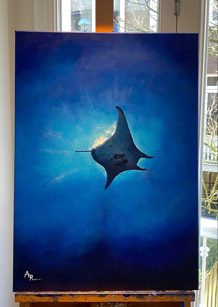 a painting of a manta ray swimming in the ocean