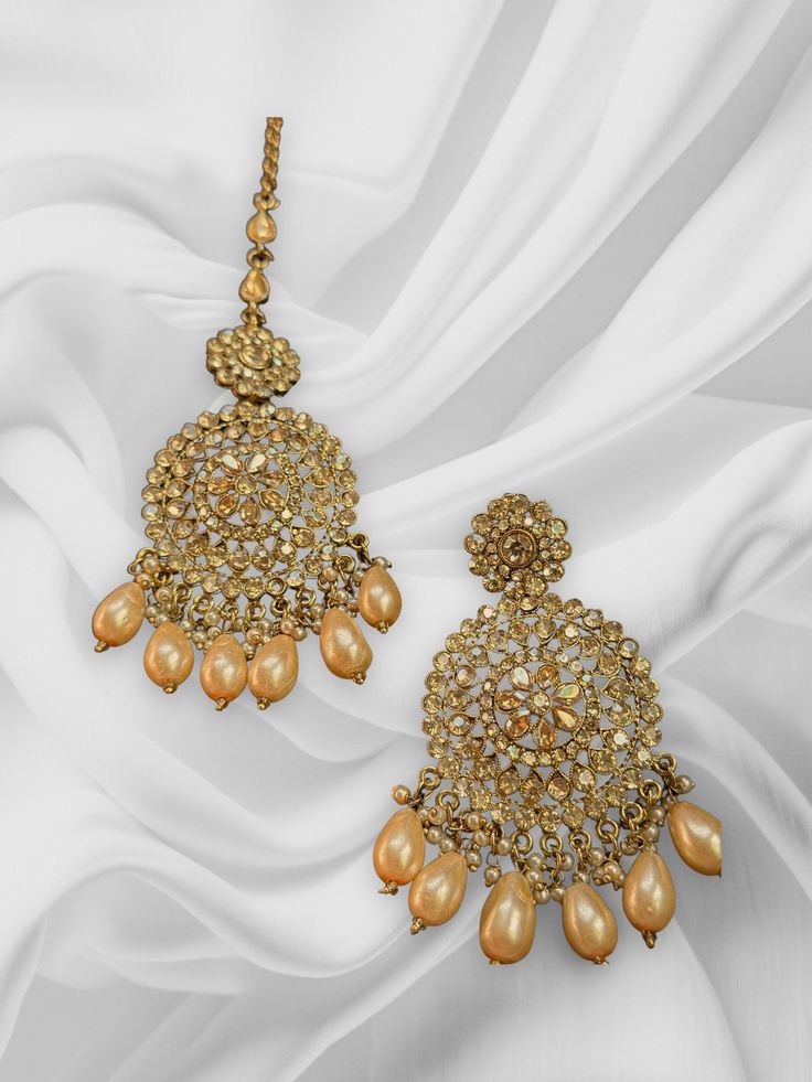 These chandbalis with matching maangtikka comes as a pair and is beautifully handmade with high quality polki stones. This set is perfect for any bridesmaid, bride, sangeet or any occasion or event as a gift for any occasion as any one who loves jewelry will love this statement piece. It has beautiful colors that really make the set a statement piece. Product Details: • Tikka • Earrings Free Shipping/Ready to Ship and available immediately if you place an order today! Fast and Free Shipping US C