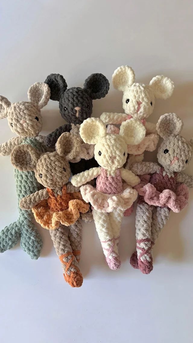 several crocheted stuffed animals are arranged together