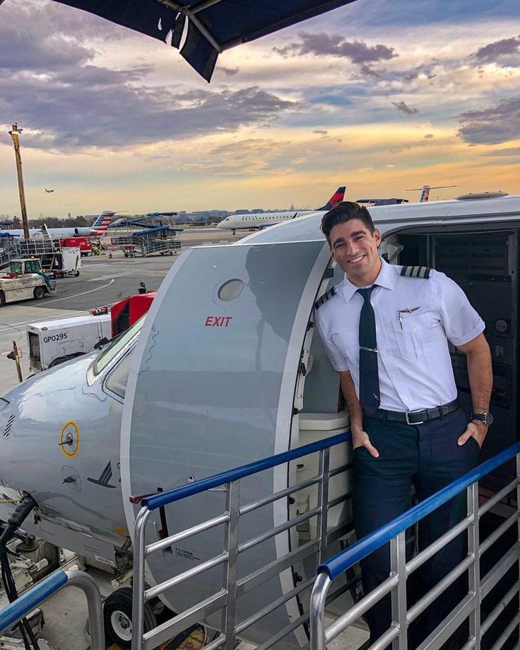 a man standing in front of an airplane