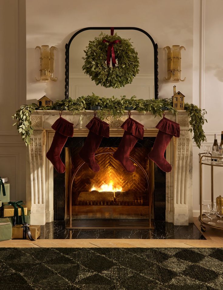 a fireplace with stockings hanging from it's mantle