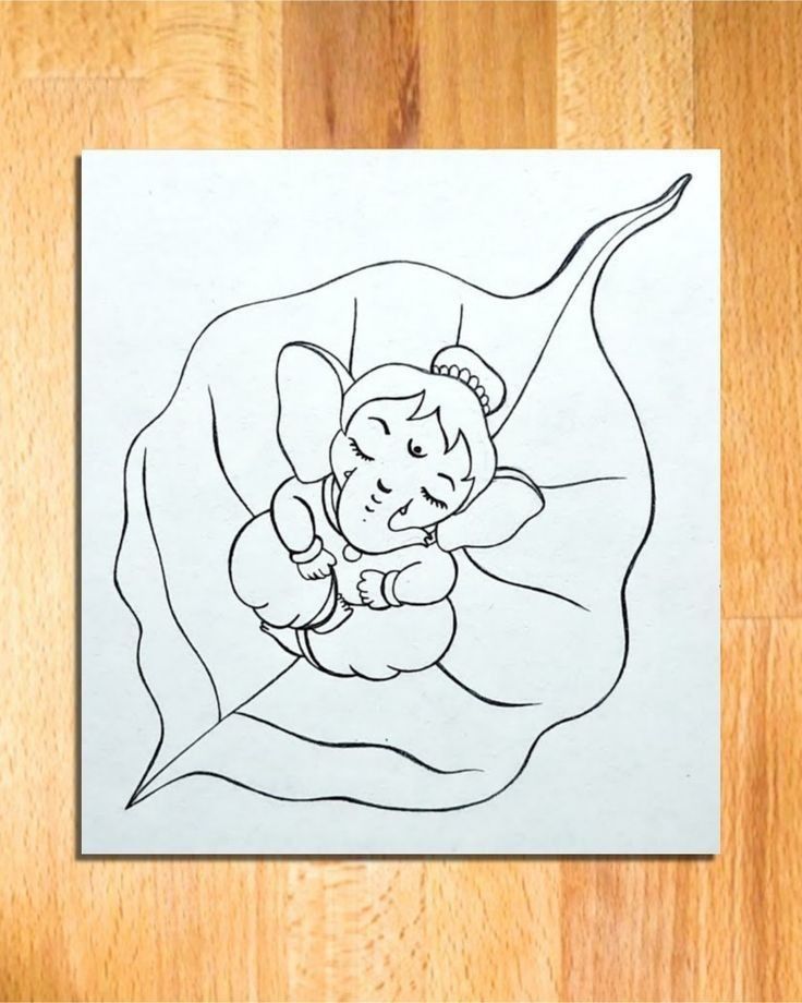 a drawing of an elephant in the middle of a leaf on a wooden floor with a wood background