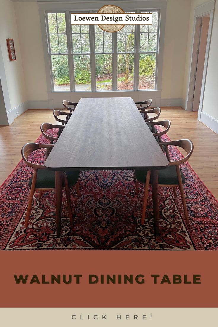 a dining room table with chairs and an area rug on the floor next to it