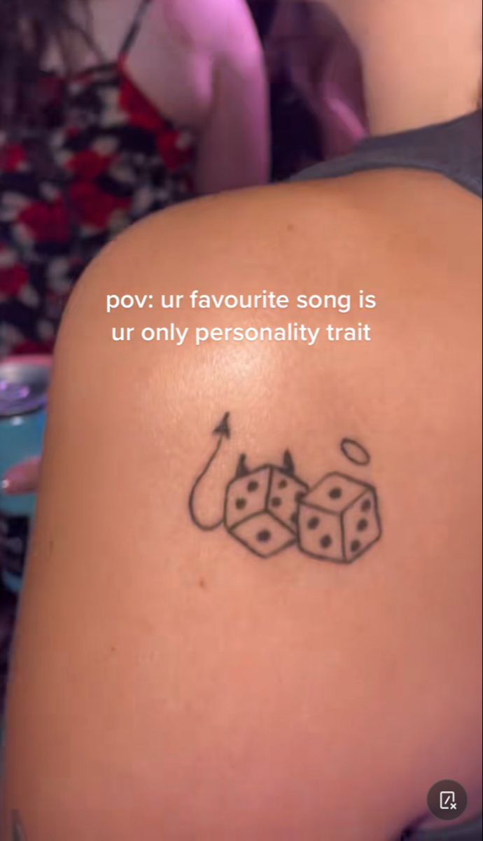 a woman with a tattoo on her shoulder saying, pov our favorite song is ur only personality